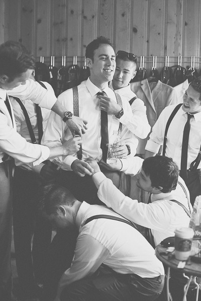 guys helping groom get ready