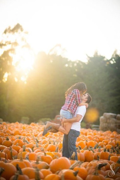 Fall Engagement Photo Ideas - Hug in a Pumpkin Patch